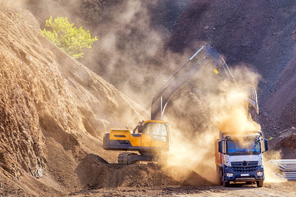 excavator,and,truck,for,construction,site.,excavation,is,the,process